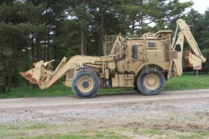 JCB HMEE (High Mobility Engineer Excavator) with added armour makes it's way across Salisbury Plain Training Area.